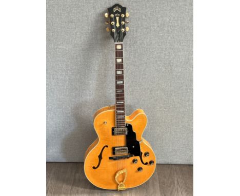 A Guild X-170 hollow body electric guitar, blonde finish, gold coloured hardware, serial number HL100217, Made in USA 12-87, 