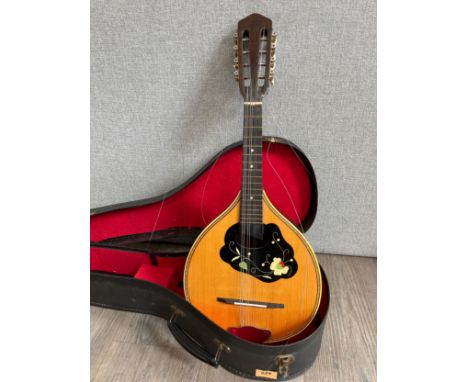 A Cremona Czechoslovakian made teardrop mandolin, sunray design to back, with hard case