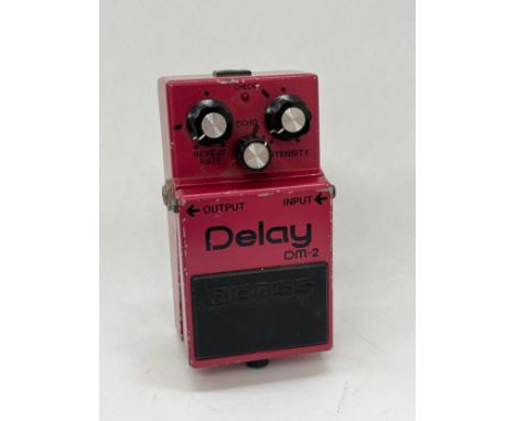 A 1980's Boss DM-2 Delay guitar effects pedal, Made in Japan, black label