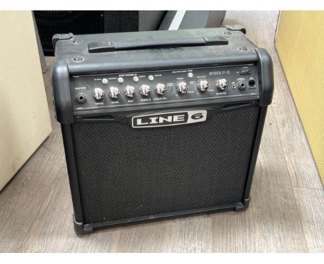 A Line 6 Spider IV 15 watt guitar amplifier with instructions 