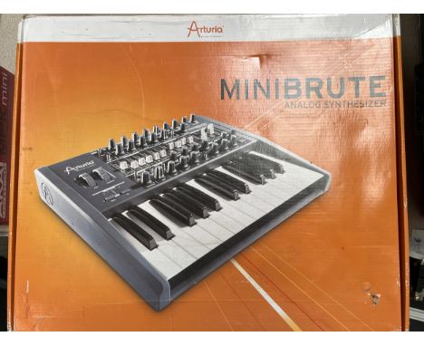 An Arturia Minibrute analog synthesizer, boxed together with a Tascam US-224 USB interface and a Hark by Marshall amplifier