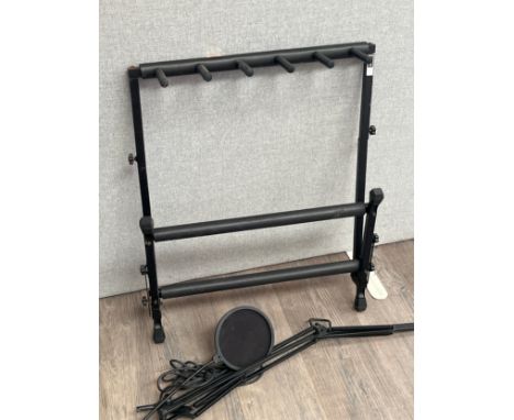 A stand for four guitars together with a desktop microphone stand with XLR cable and baffle attachment (2) 