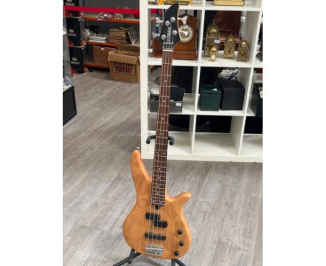 A Yamaha RBX270 electric bass guitar, natural body