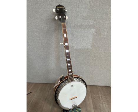 An Antoria five string banjo, closed back