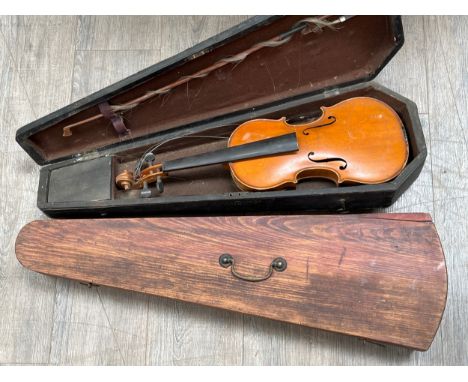 A 20th Century full size violin, no label, together with two wooden coffin cases