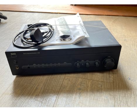 A NAD Model C352 amplifier with manual and remote 