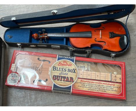 A boxed blues box guitar and a Skylark student's violin, cased (2)