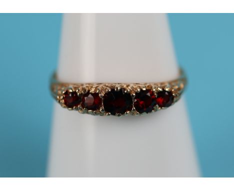 Gold 5 stone set garnet ring