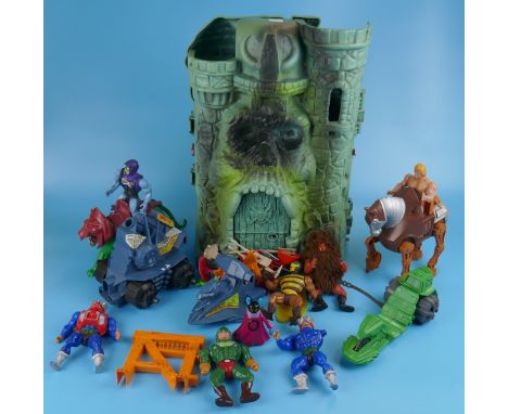 He-Man action figures together with Castle Grayskull