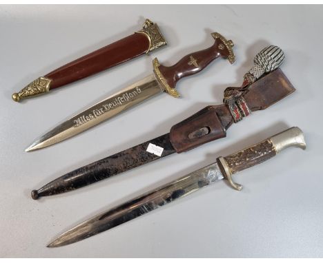 Replica German WWII period SA dress dagger and scabbard together with a German Puma bayonet with single edged fullered blade 