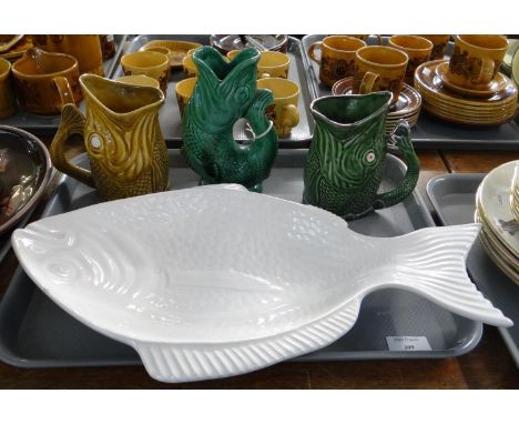 Tray of moulded ceramic fish design items to include: a fish platter, various glug glug or Gluggle jugs; two Sylvac and a Dar