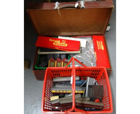 Vintage suitcase and shopping basket containing a collection of Tri-ang Hornby 00 gauge railway track, locomotives and access