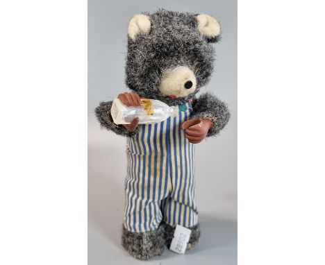 Clockwork automaton toy in the form of a bear with bottle.  19cm high approx,   (B.P. 21% + VAT) 