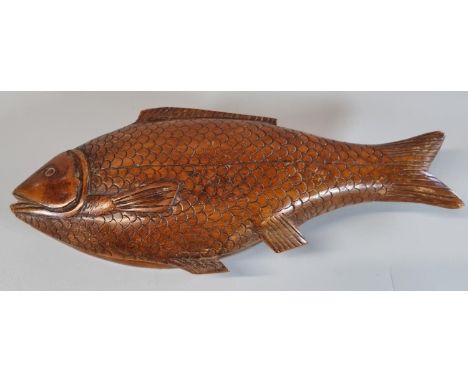 Carved wooden treen lozenge shaped box with carved carp shape lid. (B.P. 21% + VAT)  The item is 26cm long approx.   Some nic