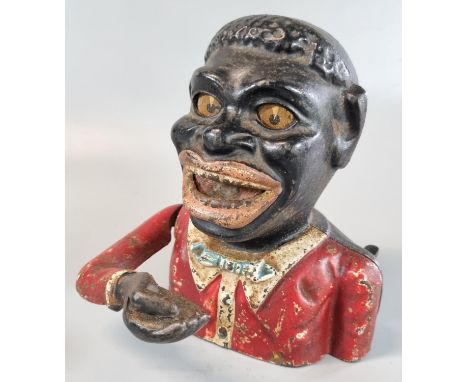 Cast iron black man money box. (B.P. 21% + VAT)These items are listed on the basis they are illustrative of a bygone culture 