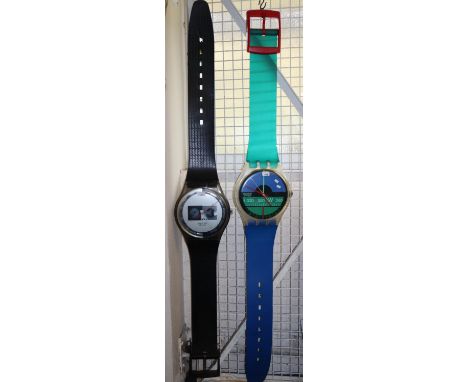 Large 'Swatch' shop advertising display wristwatch, the face marked '9.3 Swatch, Swiss' with long hanging strap together with