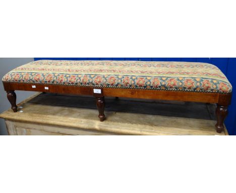 20th century tapestry upholstered fender stool with stained frame on baluster turned tapering legs.  120cm wide approx. (B.P.