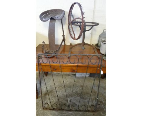 Agricultural bygones to include: vintage tractor seat, vintage cast iron water sprinkler and a wrought iron garden gate.  (3)