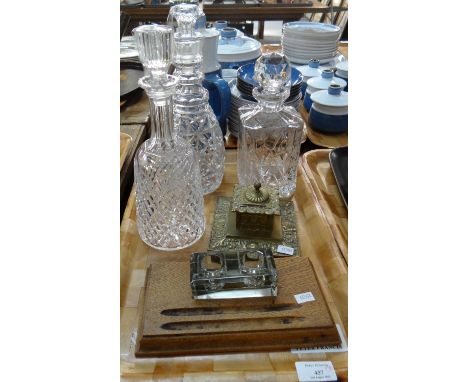 Tray of assorted items to include: three star cut base glass decanters and stoppers in various shapes, two inkwells; one bras