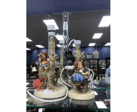 TWO GOEBEL LAMP BASEStogether with a Goebel figure 'Trim Lass'