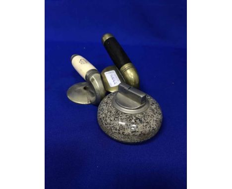 TWO CURLING STONE HANDLES and a table lighter modelled as a curling stone