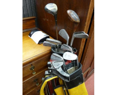 Pair of golf bags with club contents and manual trolley