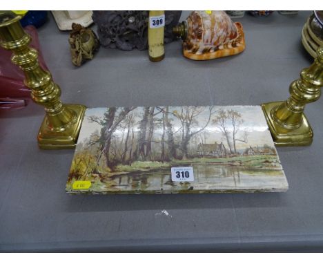 Flaxman tile teapot stand and a pair of brass candlesticks