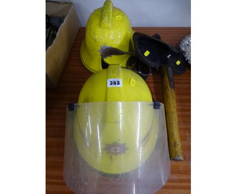 1980's North Wales Fire Service helmet and one other along with a vintage fireman's axe in leather holster