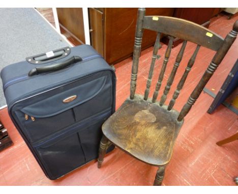 Vintage farmhouse chair and a modern canvas suitcase