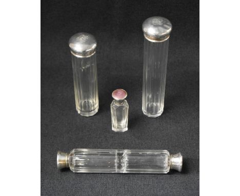 A George V silver topped cut glass scent bottle, having pink guilloche enamel to the silver top, marks for Birmingham 1922, m