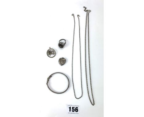 Assorted silver jewellery comprising 2 necklaces, bangle, heart locket, lion pendant and ring with yellow stone, total w: 1.3