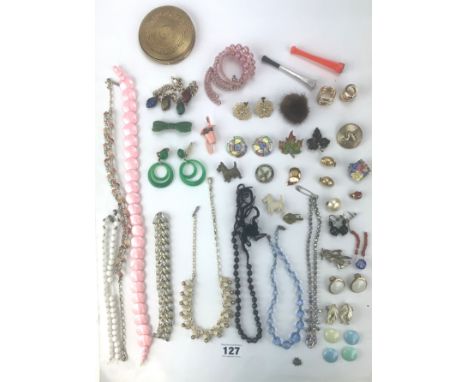 Assorted dress jewellery comprising beads, necklaces, bracelets, brooches, earrings, compact and badges