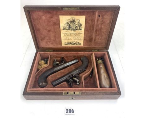 Pair of antique flintlock pocket pistols, 6" long by Clark, Holborn London in walnut case with flask and bullet mold. Label i