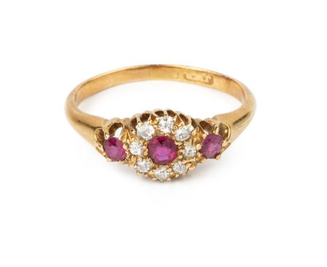 A ruby and diamond cluster ring, the circular mixed-cut rubies framed by old-cut diamonds, yellow precious metal mounted, (ma