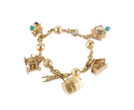 A charm bracelet, the fancy-link bracelet with fluted hollow bead spacers, stamped '750', suspending a collection of assorted