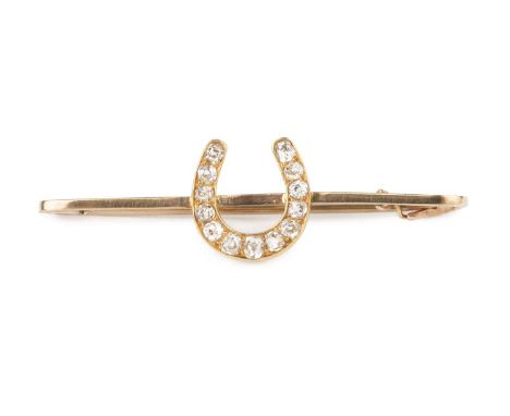 A diamond horseshoe bar brooch, highlighted with graduated old-cut diamonds, yellow precious metal mounted, the fitting stamp