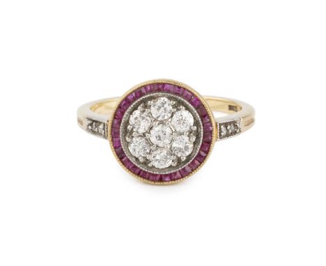 A diamond set panel ring, the circular panel centred with a pavé set cluster of old-cut diamonds, bordered by a channel of st