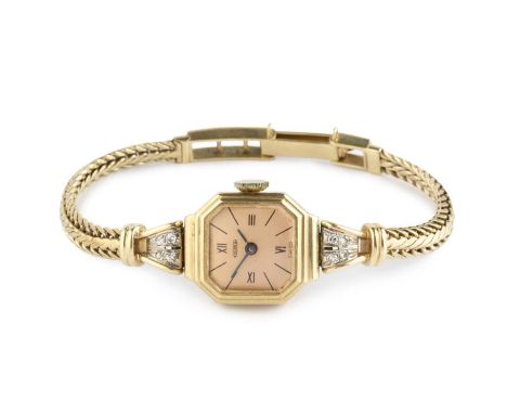 A lady's diamond set bracelet watch, the octagonal dial with Roman numeral quarters and baton markers, to a jewelled manual w