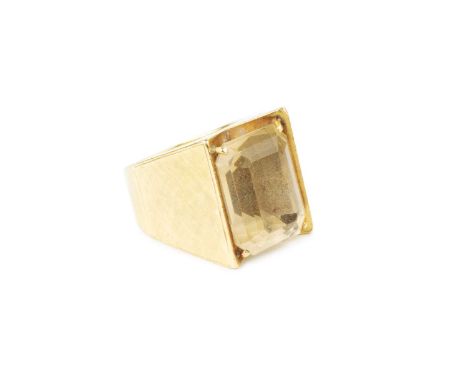 A citrine single stone dress ring, the rectangular step-cut citrine in four claw setting, to a tapered abstract mount with te