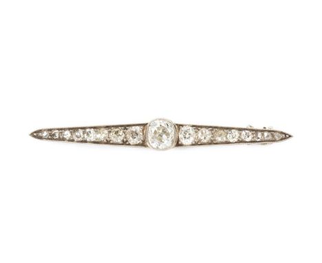A diamond bar brooch, designed as a line of graduated cushion-shaped old-cut diamonds in millegrain settings, terminating wit