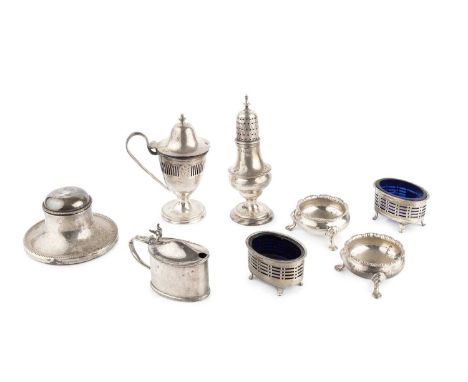 A George V silver urn shaped mustard, with pierce-decorated body, domed hinged cover and blue glass liner, by Nathan &amp; Ha