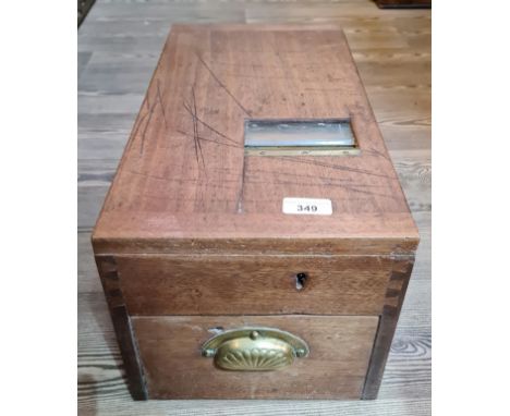 A vintage cash box labelled 'G.H. Gledhill &amp; Sons'.  