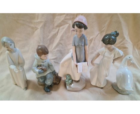 A group of five Nao figurines.  