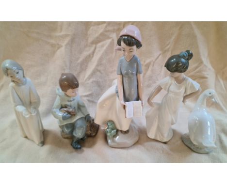 A group of five Nao figurines.  