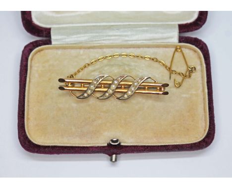 An Edwardian seed pearl brooch, marked '9c', gross wt. 2.42g, with box.  