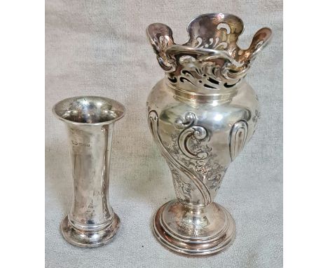 A Victorian hallmarked silver footed vase with pierced wavy top rim and decorated body, having inscribed on base "Romiley Gol