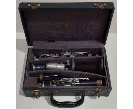 A vintage wooden Regent Boosey and Hawkes clarinet in original case.  