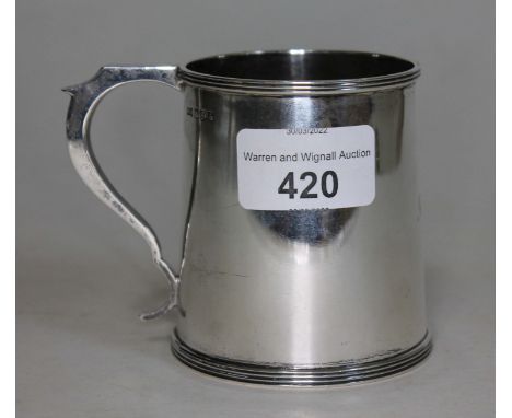 A silver christening mug, hallmarked for Sheffield, Walker &amp; Hall 1943, height 8cm, weight 189.65 grams.  