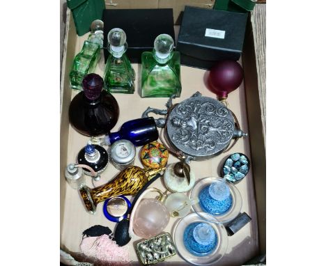 A collection of perfume and scent bottles and a metal military style flask.  