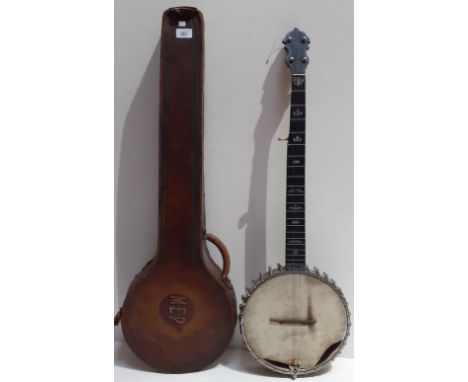 A vintage banjo in leather case, marked Richard Spencer Clapham.  Condition:- General wear through age and use, Skin damaged,